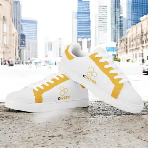 Black team sneakers with contrasting yellow logo print