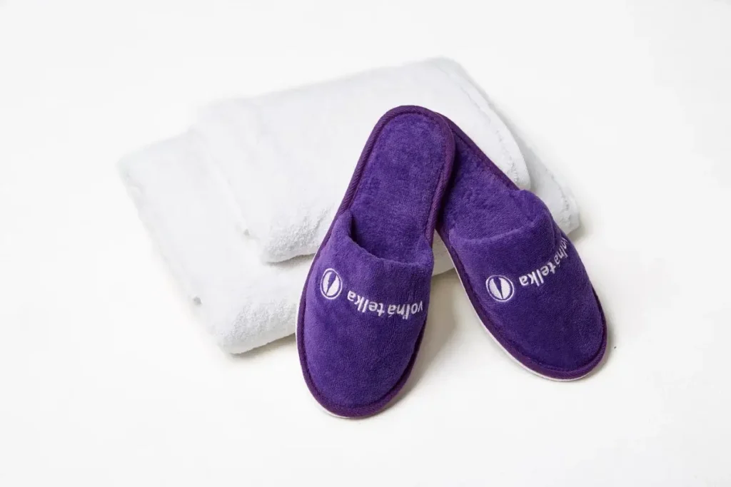 Premium hotel slippers with elegant 3D embroidered logo for wellness