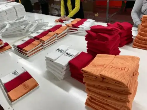 Folded promotional towels with West print