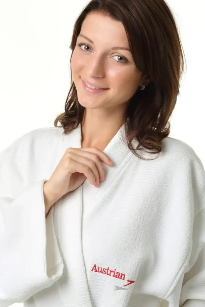White terry bathrobe with quality embroidered Austrian Airlines logo for VIP guests