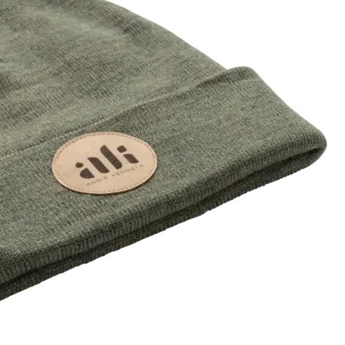 Warm winter beanie with elegant leather patch with engraved logo